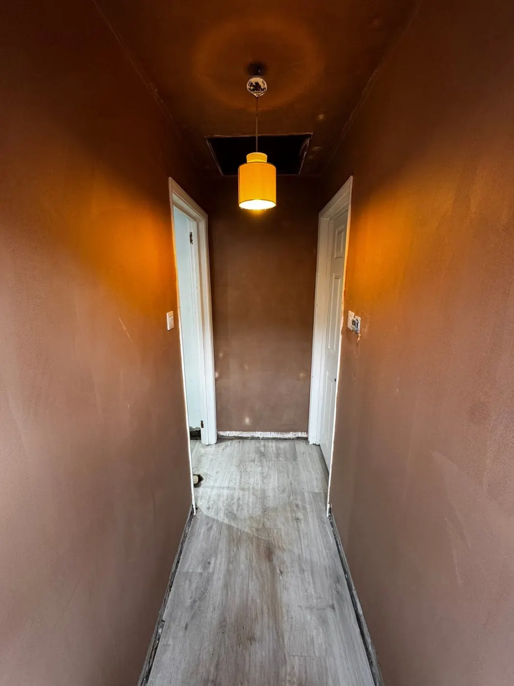 Internal Plastering Carlisle – Narrow hallway with freshly plastered walls and ceiling