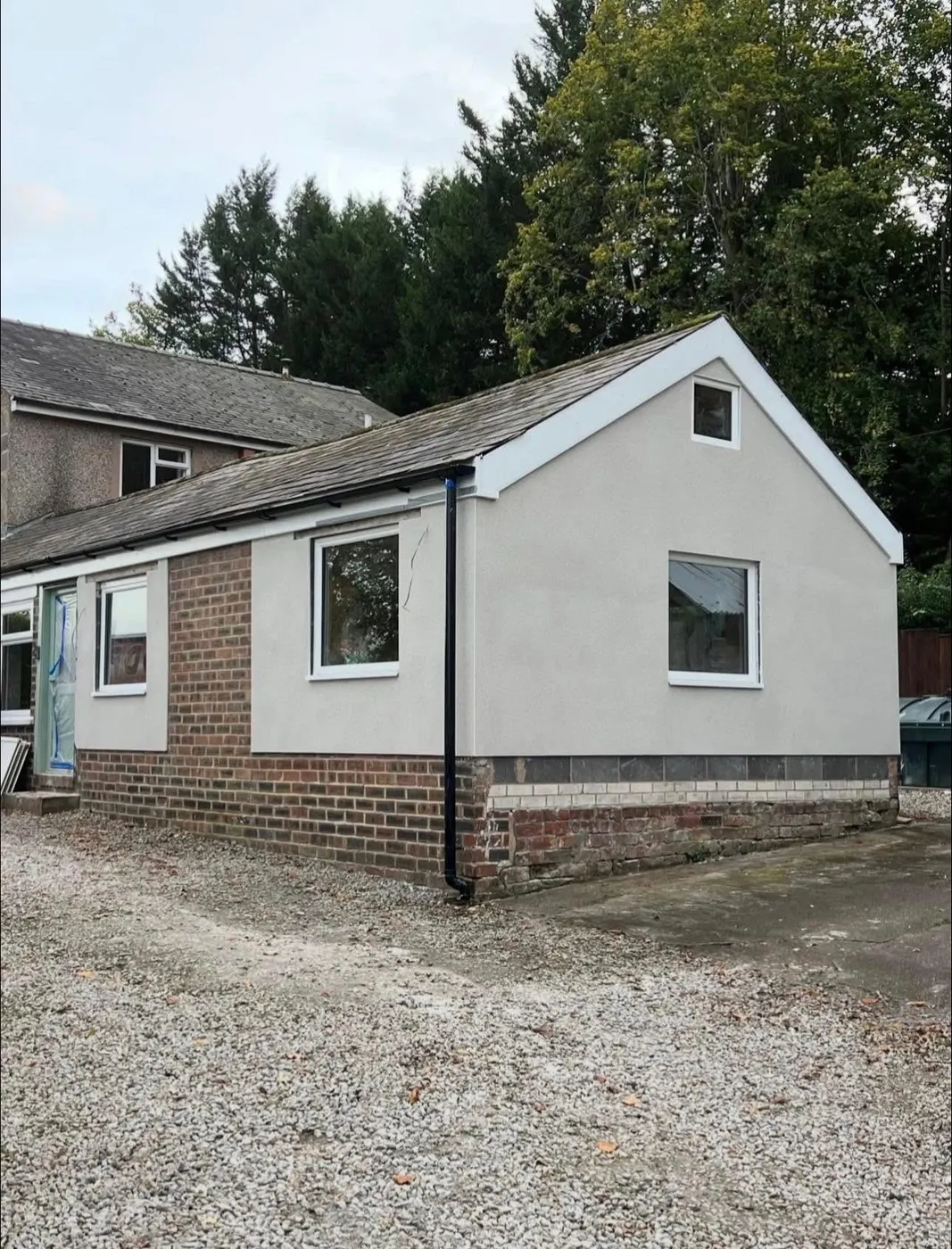 Light grey external render on a single-storey building