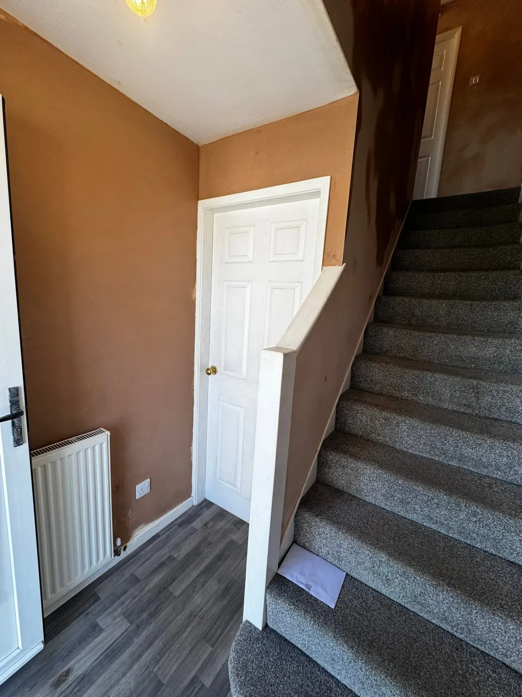 Hallway and staircase walls with fresh plaster finish